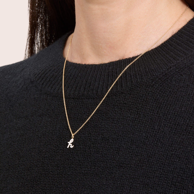 Image of 14K Yellow Gold Diamond Cursive Initial Necklace on Models Neck