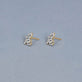 Stone and Strand 14K Yellow Gold Diamond Cursive Initial Stud Editorial Image