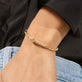 Image of 14K Yellow Gold Diamond Forme Knot Bangle on Models Arm