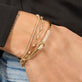 Image of 14K Yellow Gold Diamond Forme Knot Bangle with Stone and Strand Bracelets