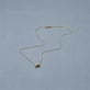 Stone and Strand 14K Yellow Gold Diamond Forme Knot Necklace Editorial Image