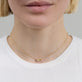 Image of 14K Yellow Gold Diamond Forme Knot Necklace on Models Neck