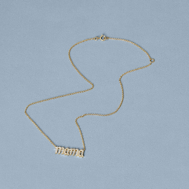 Stone and Strand 14K Yellow Gold Diamond Gothic Mama Necklace Editorial Image