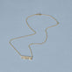 Stone and Strand 14K Yellow Gold Diamond Gothic Mama Necklace Editorial Image