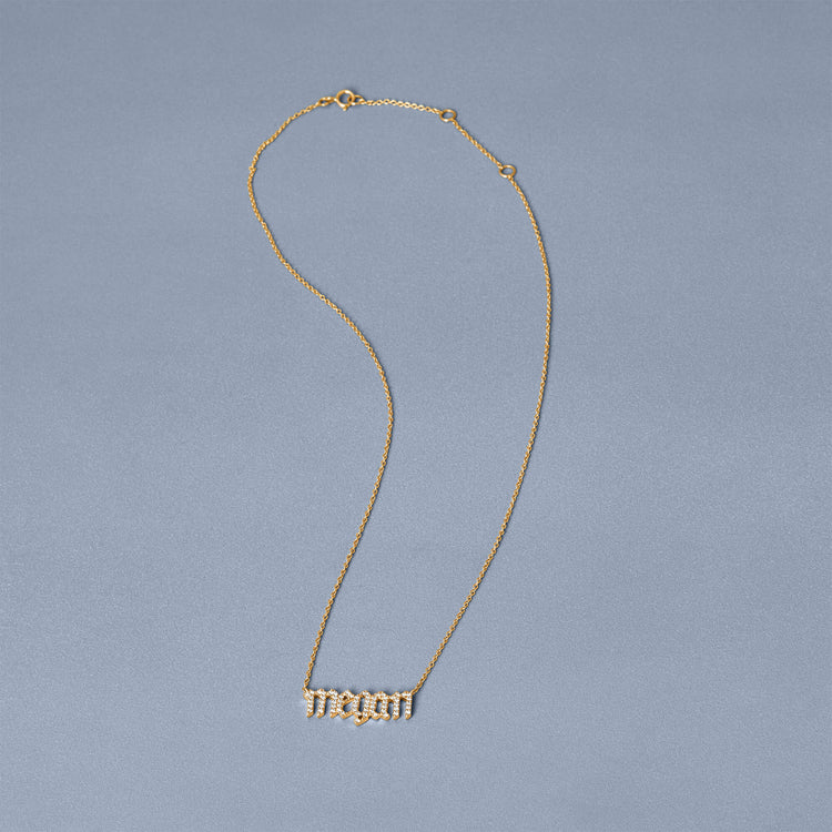Stone and Strand 14K Yellow Gold Diamond Gothic Name Necklace Editorial Image