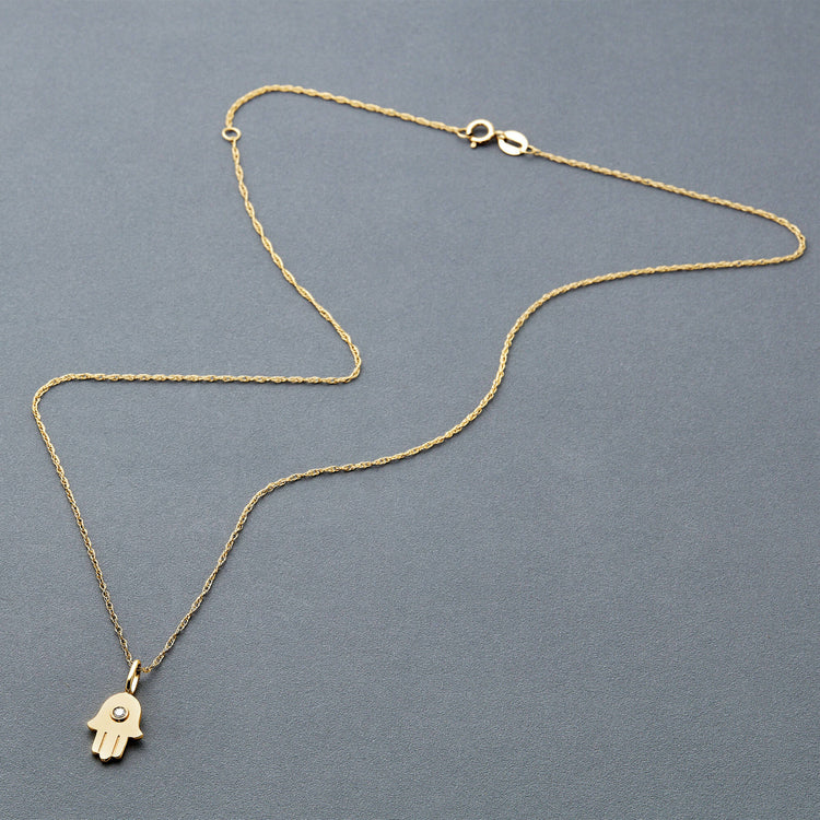 Stone and Strand 10K Yellow Gold Diamond Hamsa Necklace Editorial Image