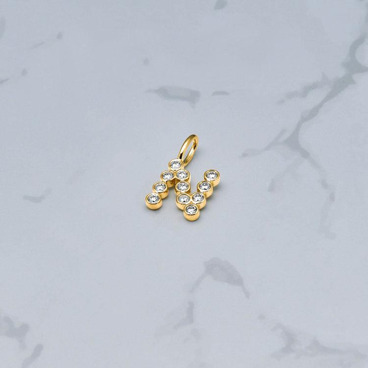 Stone and Strand 14K Yellow Gold Large Diamond Mochi Initial Charm Editorial Image