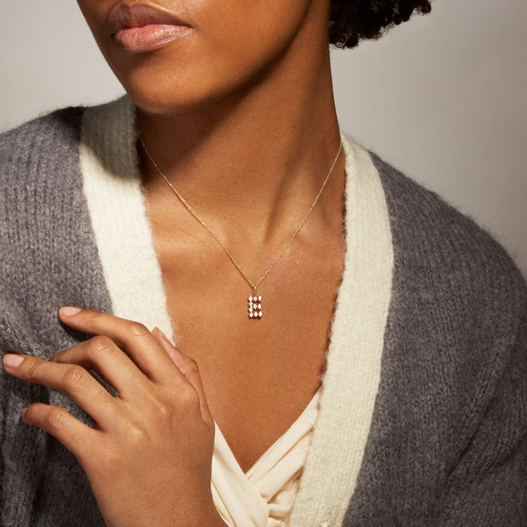 Image of 14K Yellow Gold Large Diamond Mochi Initial Necklace on Models Neck