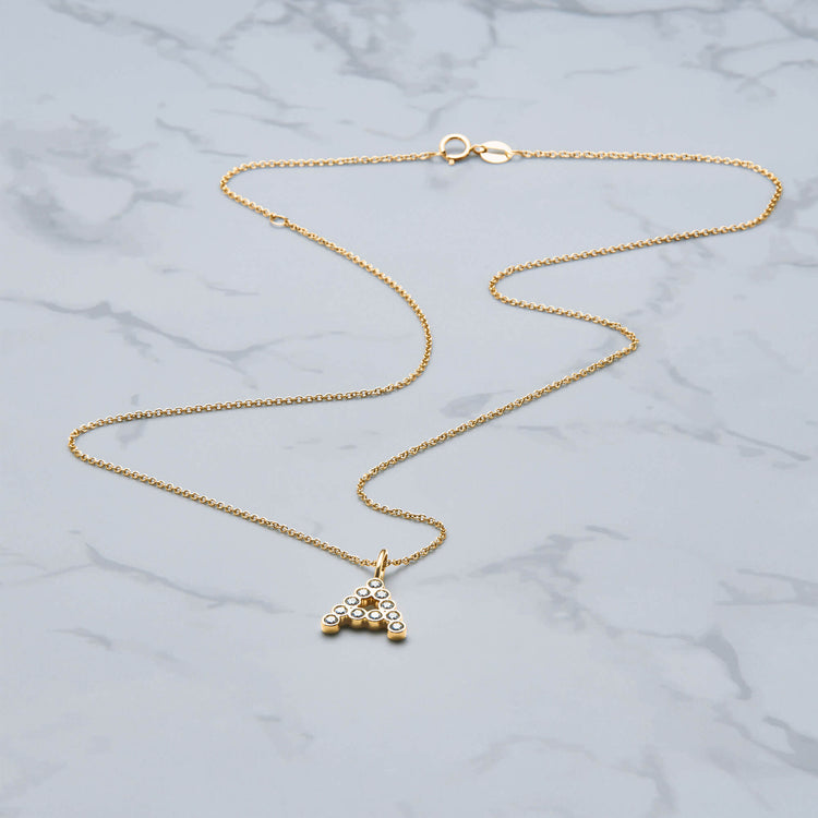 Stone and Strand 14K Yellow Gold Large Diamond Mochi Initial Necklace Editorial Image