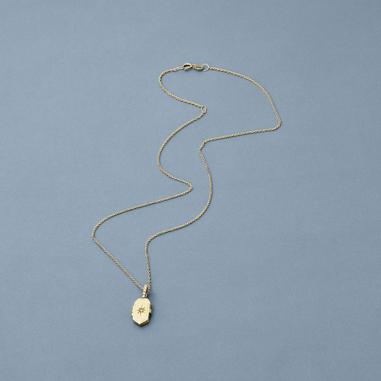 Stone and Strand 14K Yellow Gold Diamond Northern Star Locket Necklace Editorial Image