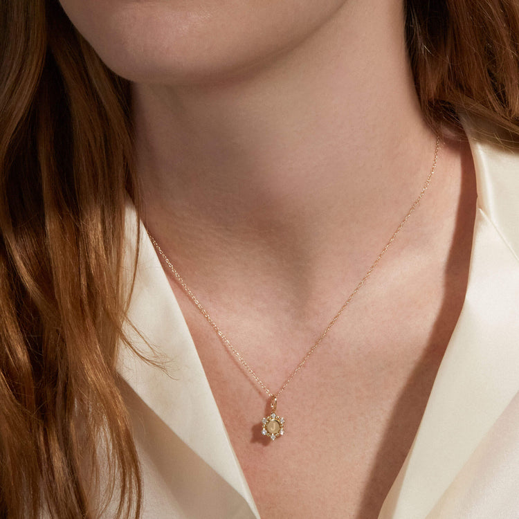 Image of 10K Yellow Gold Diamond Orbit Mini Medallion on Models Neck