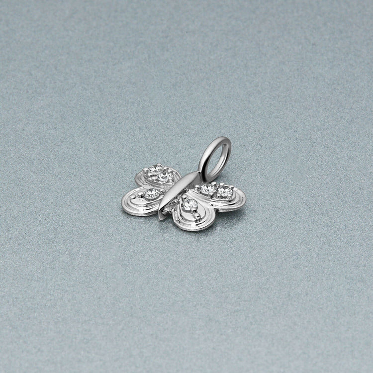 Stone and Strand 10K White Gold Diamond Puff Butterfly Charm Editorial Image