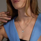 Image of 10K White Gold Diamond Puff Butterfly Charm on Models Neck