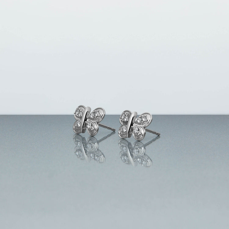 Stone and Strand 10K White Gold Diamond Puff Butterfly Studs Editorial Image