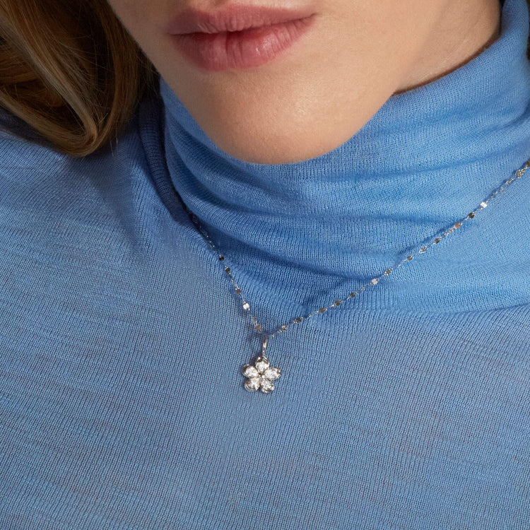 Image of 10K White Gold Diamond Puff Daisy Charm on Models Neck