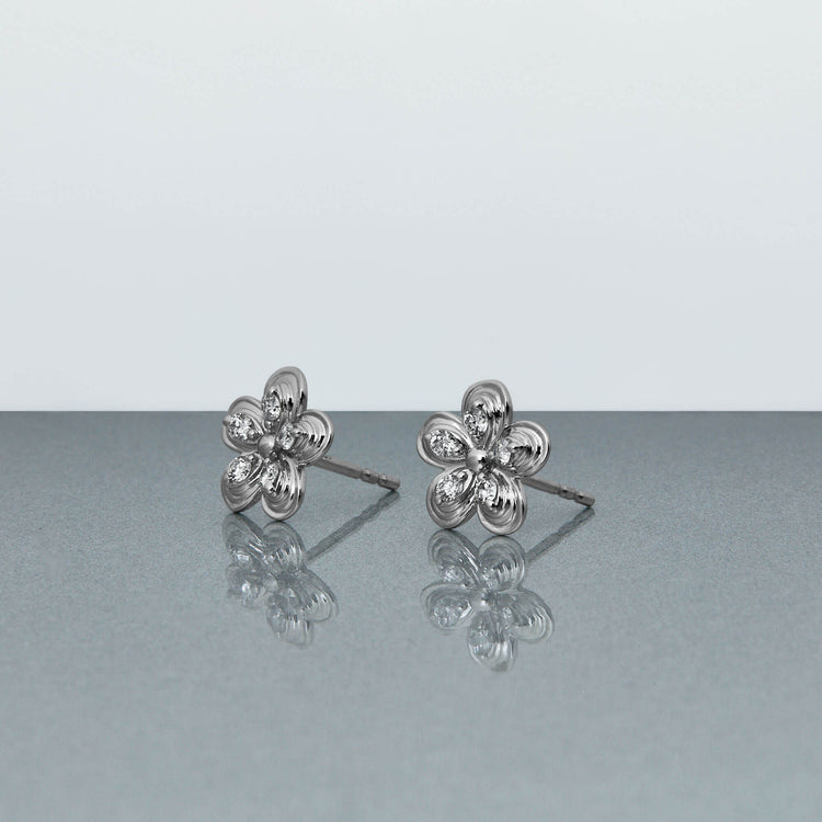 Stone and Strand 10K White Gold Diamond Puff Daisy Studs Editorial Image