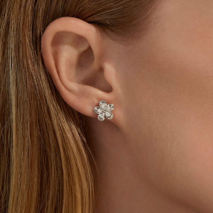 Image of 10K White Gold Diamond Puff Daisy Studs on Models Ear