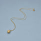 Stone and Strand 14K Yellow Gold Diamond Pufferfish Necklace Editorial Image