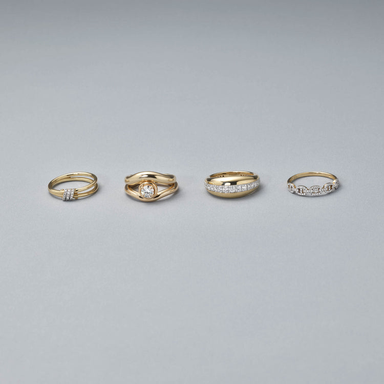 Still life image of Bold Merge Ring with Stone and Strand solid gold jewelry
