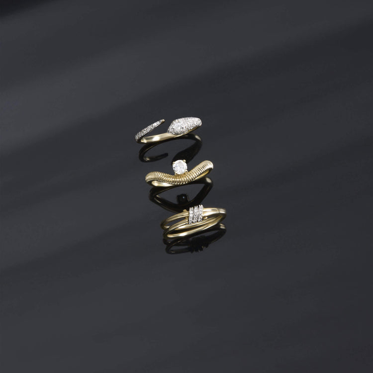 Still life image of Tina Solitaire Ring with Stone and Strand solid gold jewelry