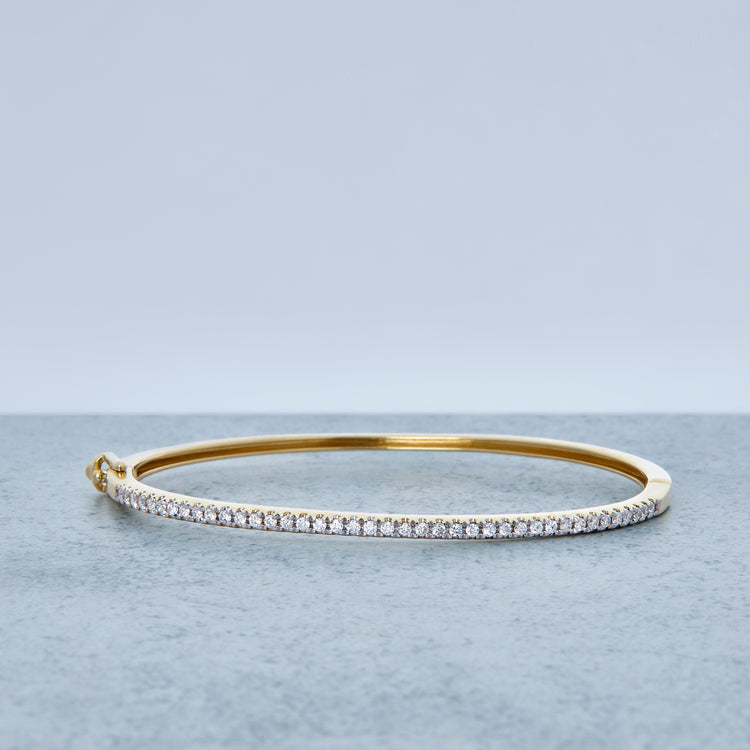 Stone and Strand 14K Yellow Gold Diamond Stroke Tennis Bangle Editorial Image