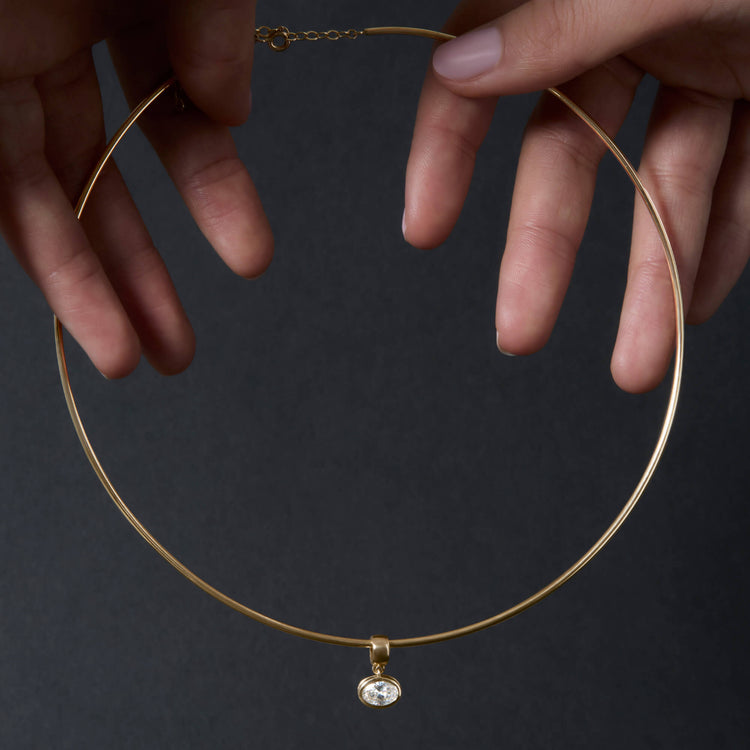 Still life image of Lab-Created Oval Diamond Charm with Stone and Strand solid gold jewelry