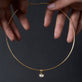 Still life image of Lab-Created Oval Diamond Charm with Stone and Strand solid gold jewelry