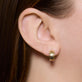 Image of 14K Yellow Gold Disco Huggies on Models Ear