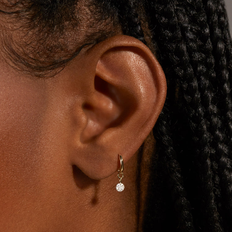 Image of 10K Yellow Gold Second Hole Disco Huggies on Models Ear