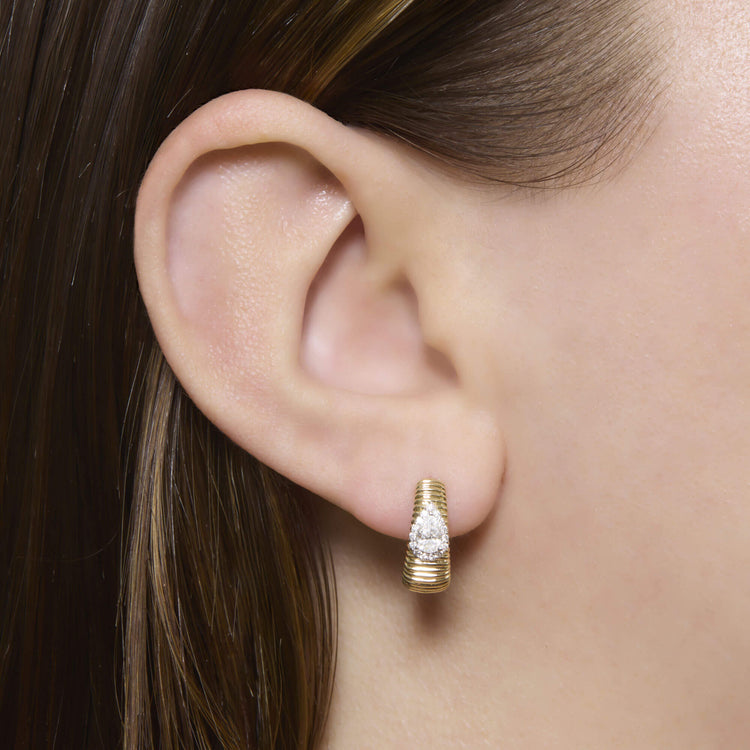 Image of 14K Yellow Gold Disco Pear Huggies on Models Ear