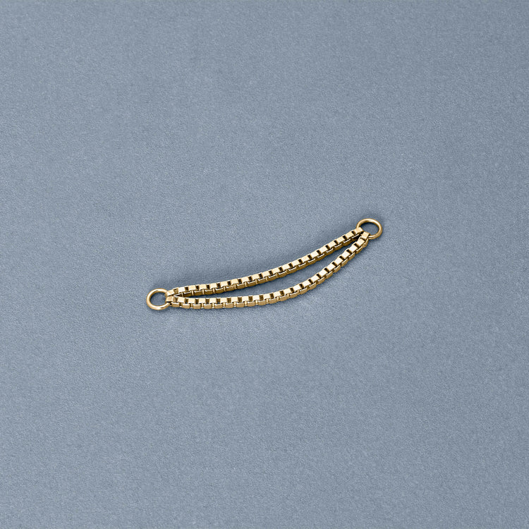 Stone and Strand 14K Yellow Gold Double Block Chain Connector Earring Editorial Image