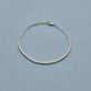 Stone and Strand 10K Yellow Gold Drop Shot Diamond Tennis Bracelet Editorial Image
