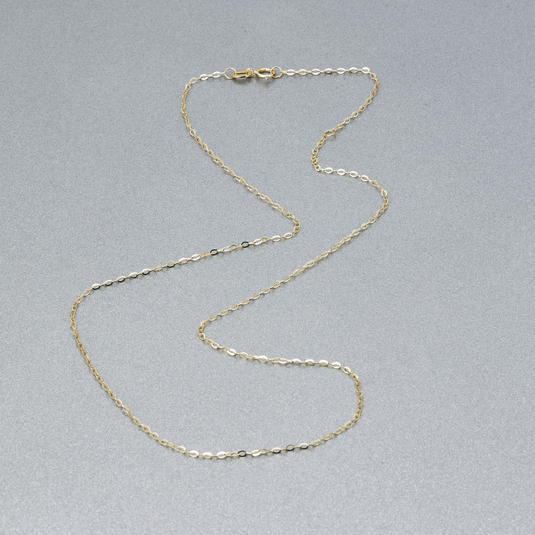 Stone and Strand 10K Yellow Gold Dainty Dappled Link Chain Editorial Image