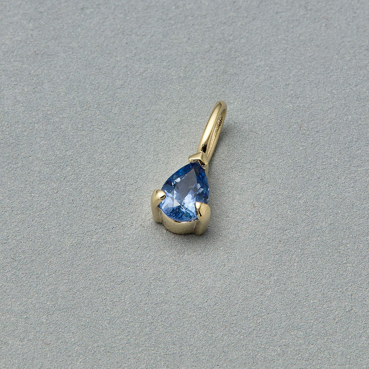 Stone and Strand 14K Yellow Gold Elegant Pear Birthstone Charm Editorial Image