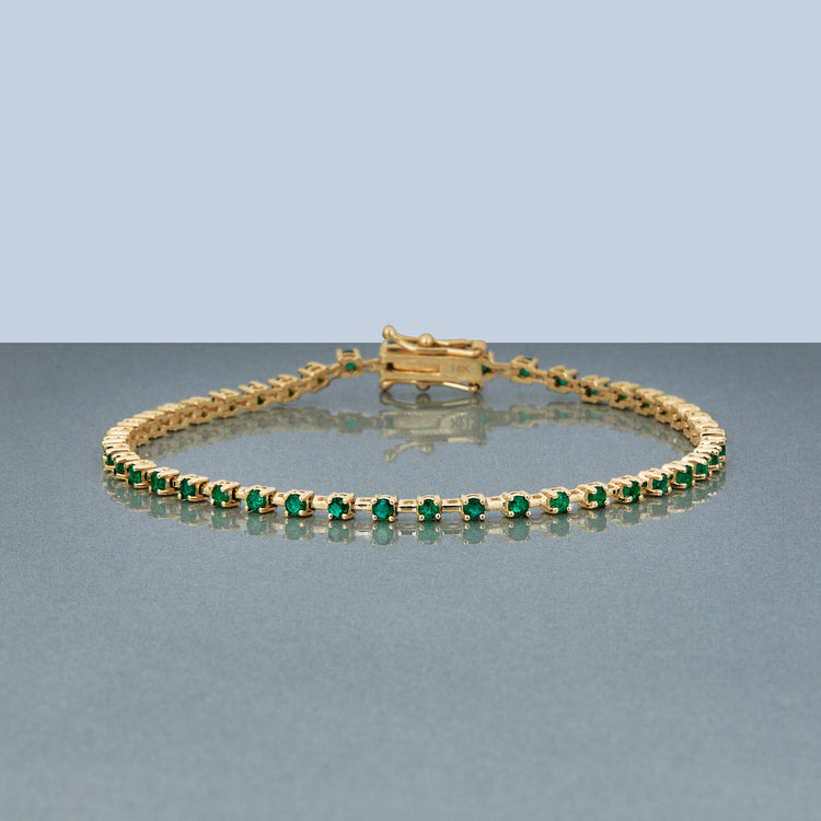 Stone and Strand 14K Yellow Gold Emerald Ace Tennis Bracelet Editorial Image