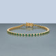 Stone and Strand 14K Yellow Gold Emerald Ace Tennis Bracelet Editorial Image
