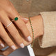 Image of 14K Yellow Gold Emerald Ace Tennis Bracelet on Models Arm