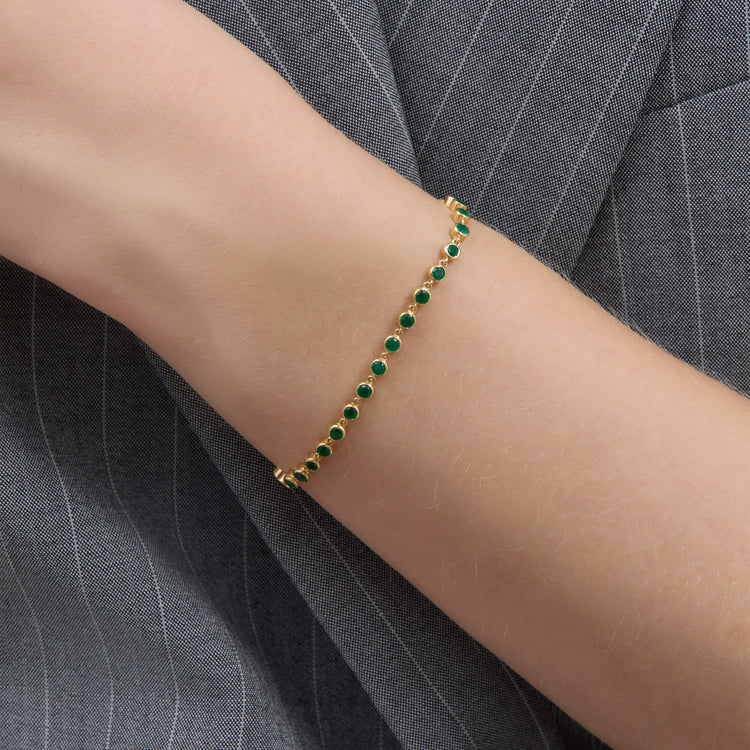 Image of 14K Yellow Gold Emerald Luxe Bezel Tennis Bracelet on Models Arm