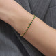 Image of 14K Yellow Gold Emerald Luxe Bezel Tennis Bracelet on Models Arm