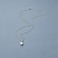 Stone and Strand 14K Yellow Gold Essential Pearl Necklace Editorial Image