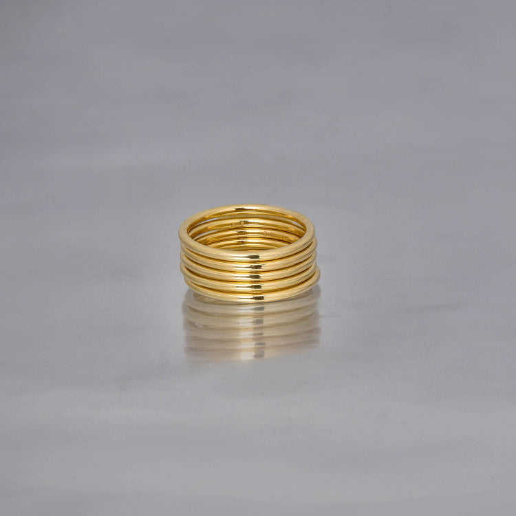 Stone and Strand 10K Yellow Gold Five Golden Rings Editorial Image
