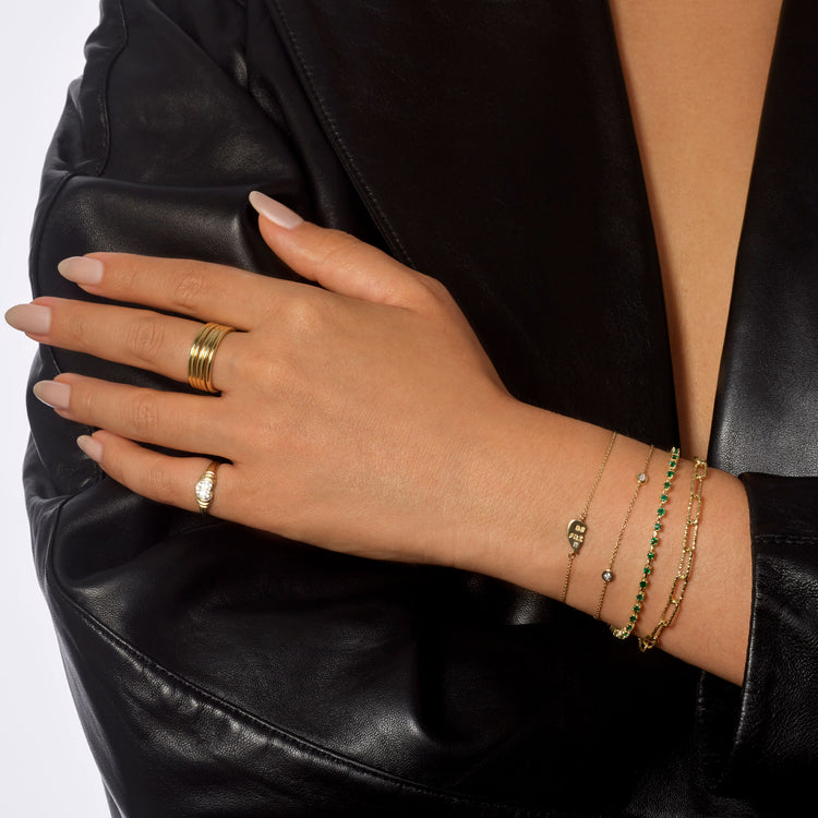 Model wearing Five Golden Rings with solid gold Stone and Strand jewelry