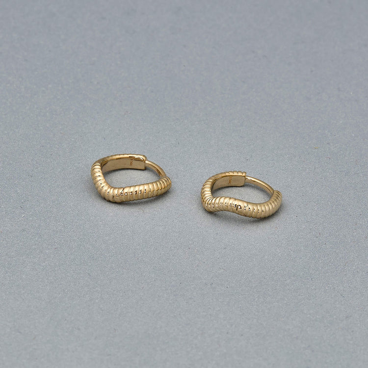 Stone and Strand 14K Yellow Gold Freddie Huggies Editorial Image