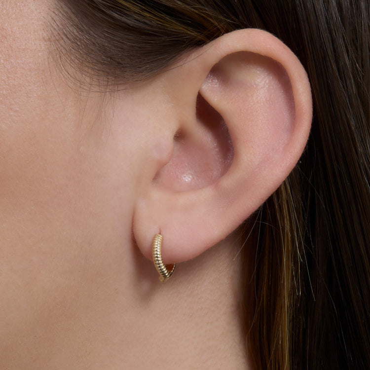 Image of 14K Yellow Gold Freddie Huggie on Models Ear