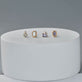 Still life image of Birthstone Emerald Cut Bonbon Studs with Stone and Strand solid gold jewelry