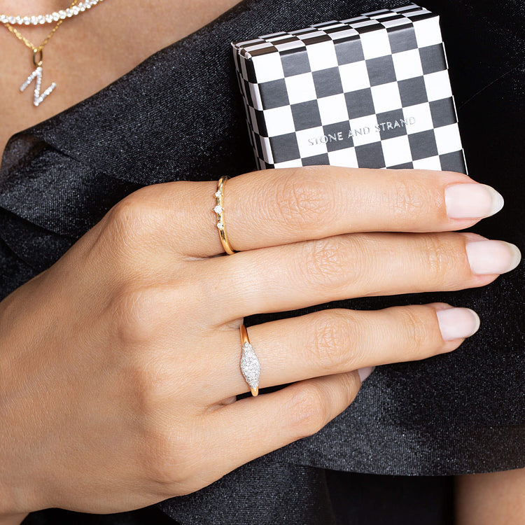 Model wearing Dainty Diamond Trio Ring with solid gold Stone and Strand jewelry and gift box