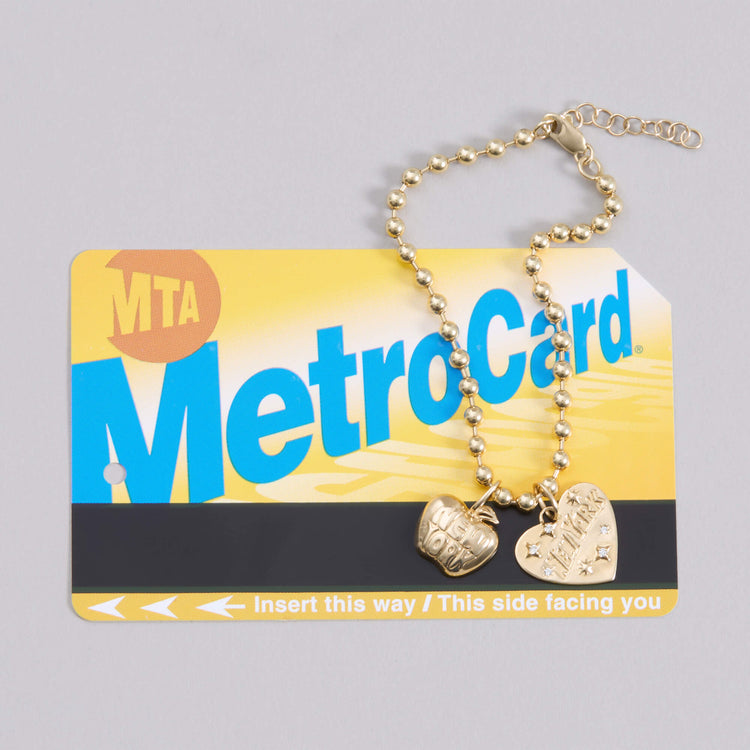 Still life image of Love New York Diamond Charm with Stone and Strand solid gold jewelry