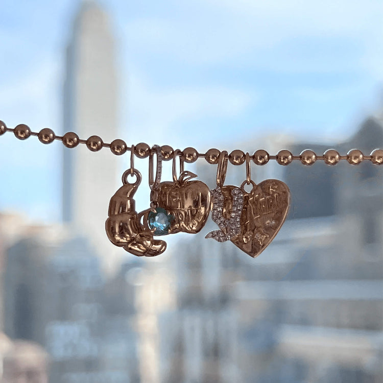 Still life image of Fairy Box Croissant Charm with Stone and Strand solid gold jewelry