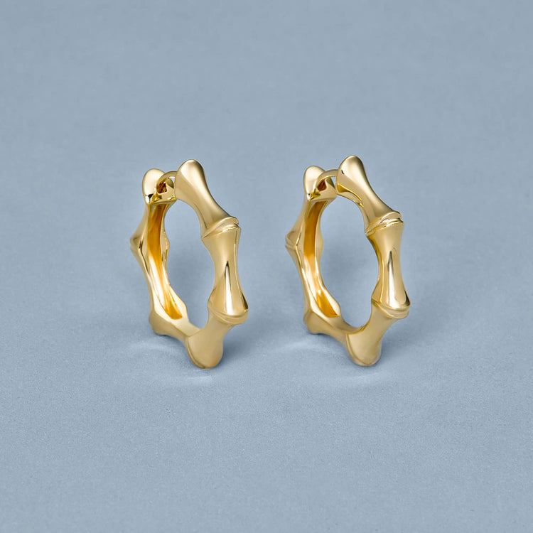 Stone and Strand 14K Yellow Gold Gold Bamboo Huggies Editorial Image