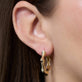 Image of 14K Yellow Gold Gold Bamboo Huggies on Models Ear